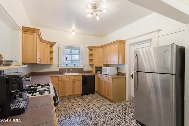 kitchen with white microwave, open shelves, freestanding refrigerator, a sink, and black dishwasher