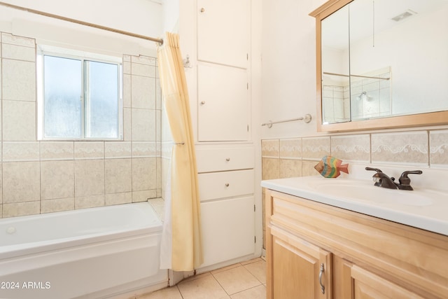 bathroom featuring visible vents, shower / bathtub combination with curtain, tile walls, tile patterned flooring, and vanity