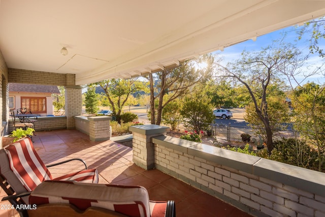 view of patio / terrace featuring fence