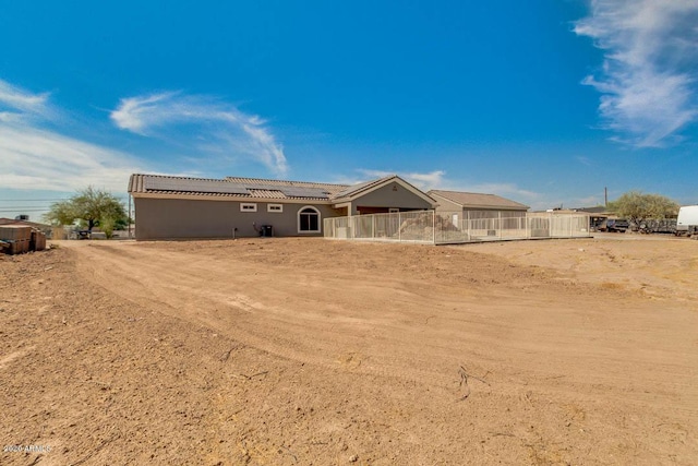 1101 S 4th St, Avondale, AZ 85323 - rear view of house featuring solar panels