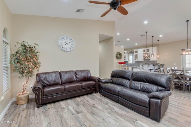 1101 S 4th St, Avondale, AZ 85323 - living area with light wood finished floors, a ceiling fan, lofted ceiling, and recessed lighting