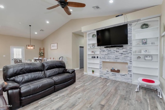 1101 S 4th St, Avondale, AZ 85323 - living room with wood finished floors, built in features, ceiling fan, lofted ceiling, and recessed lighting