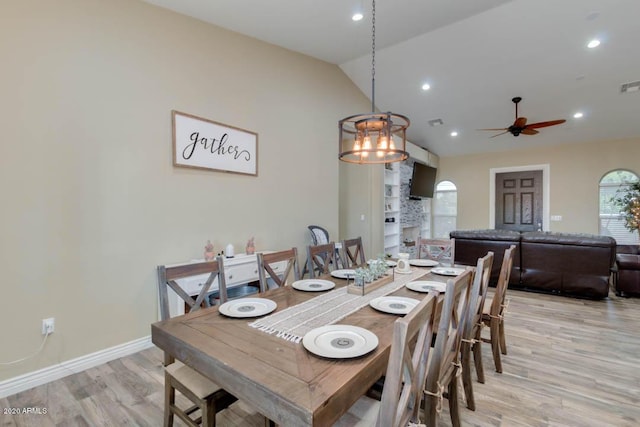 1101 S 4th St, Avondale, AZ 85323 - dining room featuring vaulted ceiling, light wood-style floors, ceiling fan, and recessed lighting