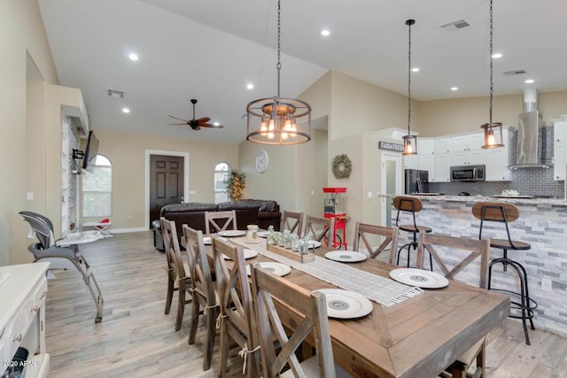 1101 S 4th St, Avondale, AZ 85323 - dining room featuring ceiling fan, light wood-style floors, high vaulted ceiling, and recessed lighting