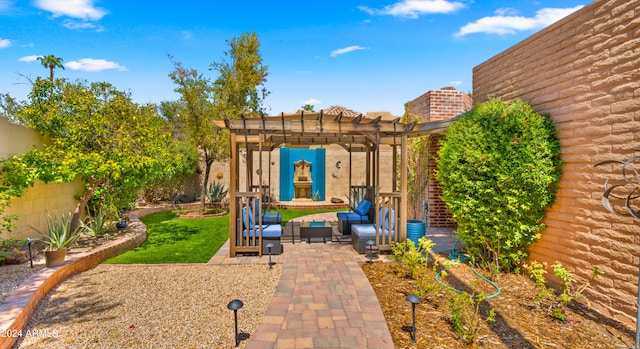 view of yard with an outdoor living space, a pergola, and a patio area