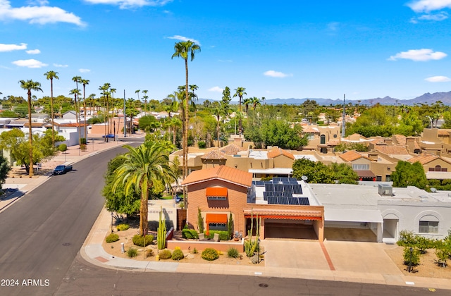 birds eye view of property with a mountain view