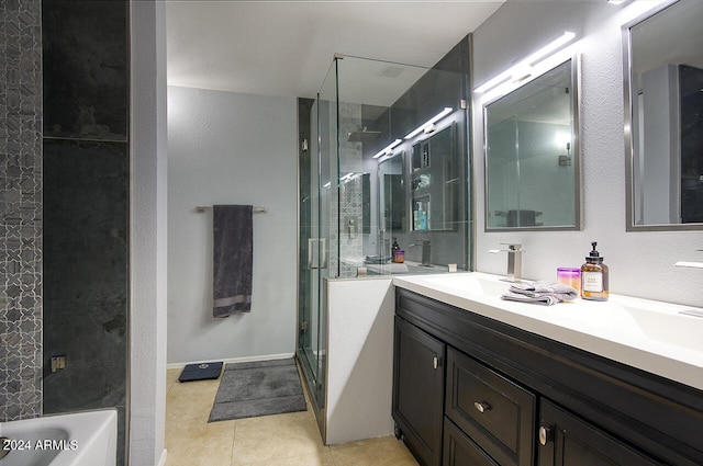 bathroom with tile patterned floors, vanity, and independent shower and bath