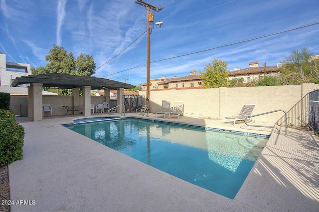 view of swimming pool with a patio