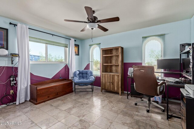 1024 E Saddle Mountain Rd, Phoenix, AZ 85086 - home office with healthy amount of natural light, a ceiling fan, and marble look tile flooring