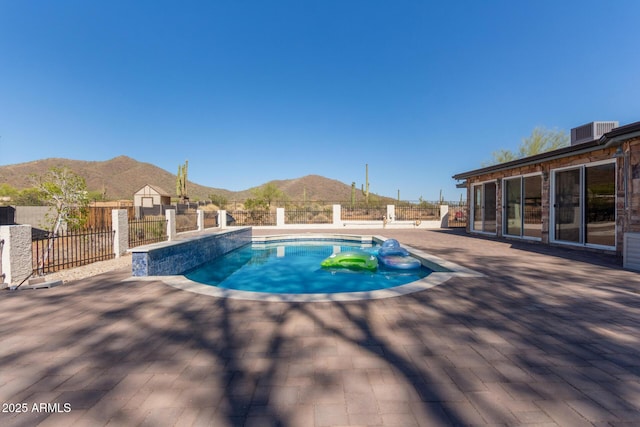 1024 E Saddle Mountain Rd, Phoenix, AZ 85086 - view of swimming pool with a mountain view, a patio, and central air condition unit