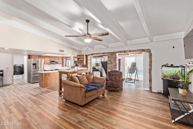 1024 E Saddle Mountain Rd, Phoenix, AZ 85086 - living room featuring washer / dryer, ceiling fan, and light wood-type flooring
