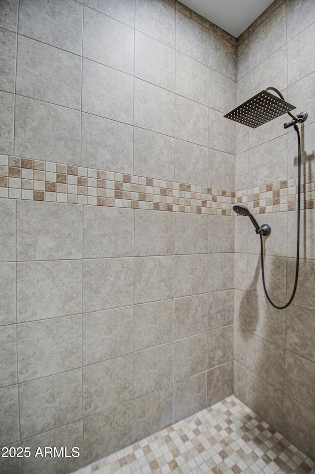 full bath with tiled shower