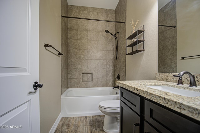 full bathroom featuring vanity, shower / bathing tub combination, wood finished floors, and toilet