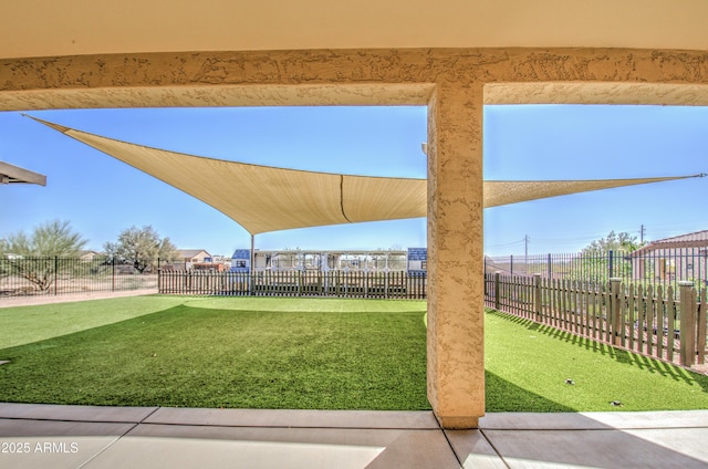 view of home's community featuring a yard and fence