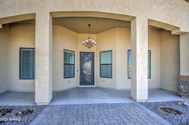 property entrance featuring stucco siding