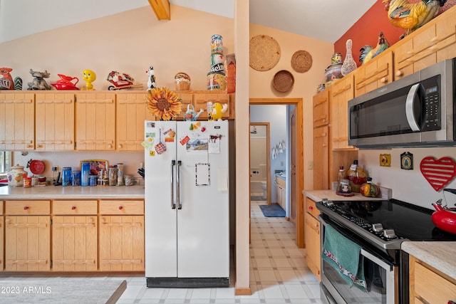 kitchen with vaulted ceiling with beams, stainless steel appliances, and light brown cabinetry