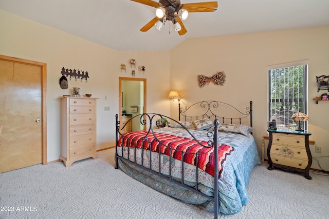 carpeted bedroom featuring ceiling fan and lofted ceiling