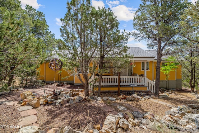 rear view of house with a wooden deck