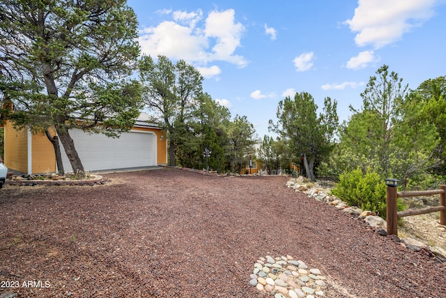 view of yard featuring a garage