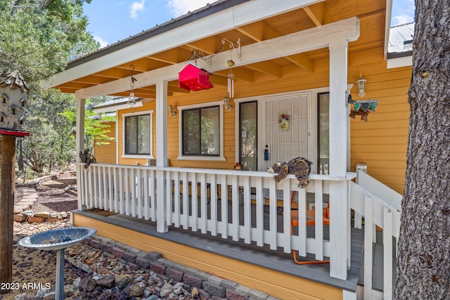 doorway to property with a porch