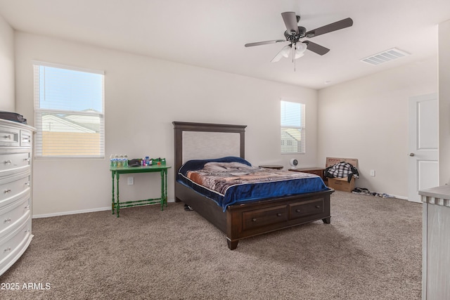 bedroom with ceiling fan, carpet, visible vents, and baseboards