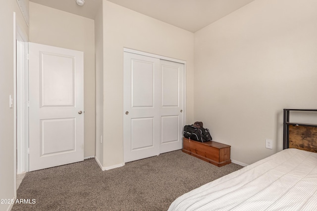 bedroom with carpet flooring and baseboards