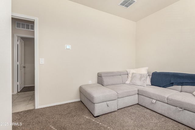 living room featuring carpet floors, visible vents, and baseboards