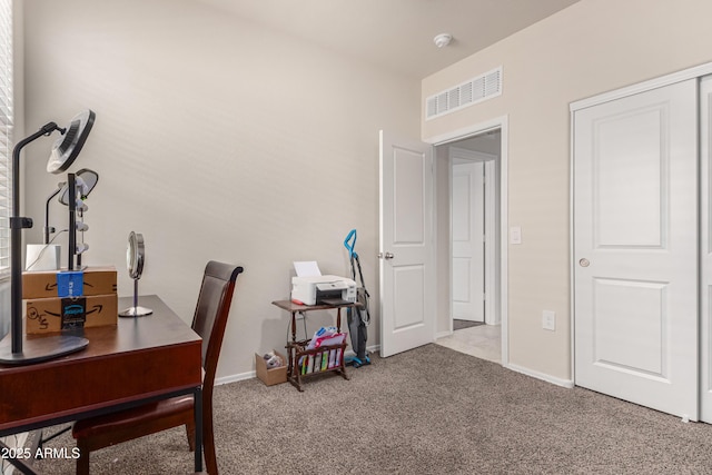 office area featuring carpet, visible vents, and baseboards