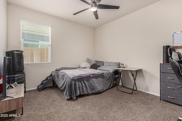 carpeted bedroom featuring ceiling fan and baseboards