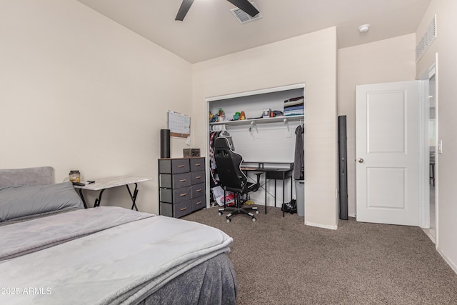 carpeted bedroom featuring ceiling fan, a closet, and visible vents