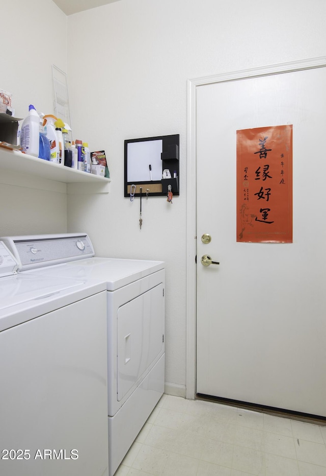 washroom with laundry area, separate washer and dryer, and light floors