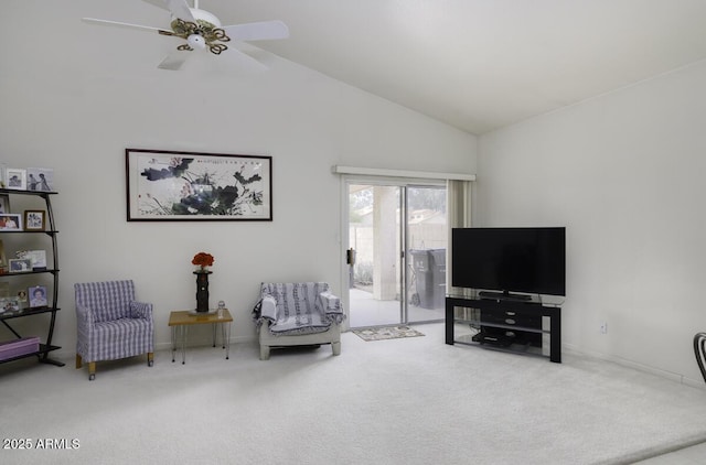 living area featuring vaulted ceiling, carpet floors, and ceiling fan