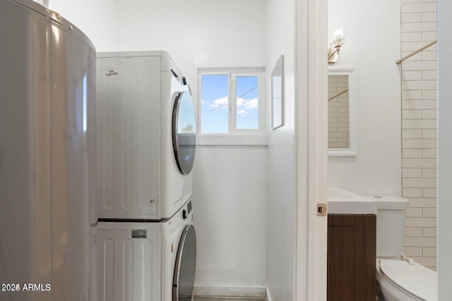 5011 S 20th Pl, Phoenix, AZ 85040 - laundry room featuring stacked washer / dryer