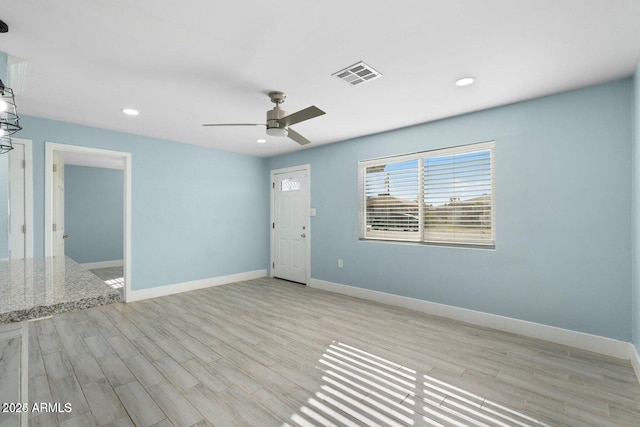 5011 S 20th Pl, Phoenix, AZ 85040 - empty room featuring light wood-style floors, a ceiling fan, baseboards, and recessed lighting