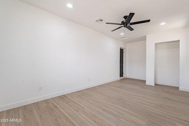 unfurnished bedroom featuring visible vents, recessed lighting, light wood-style flooring, and baseboards