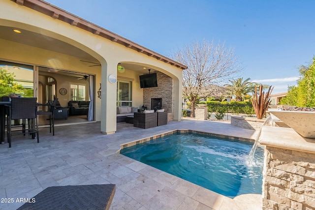 view of pool featuring a ceiling fan, a patio area, outdoor lounge area, and fence