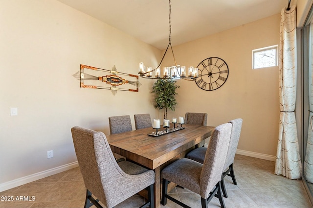 dining area featuring light tile patterned floors, an inviting chandelier, and baseboards