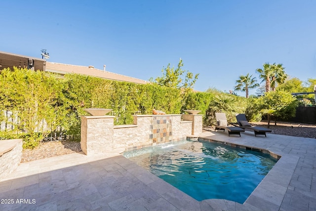 view of swimming pool featuring a patio