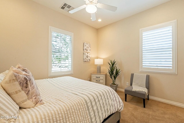 carpeted bedroom with a ceiling fan, recessed lighting, visible vents, and baseboards