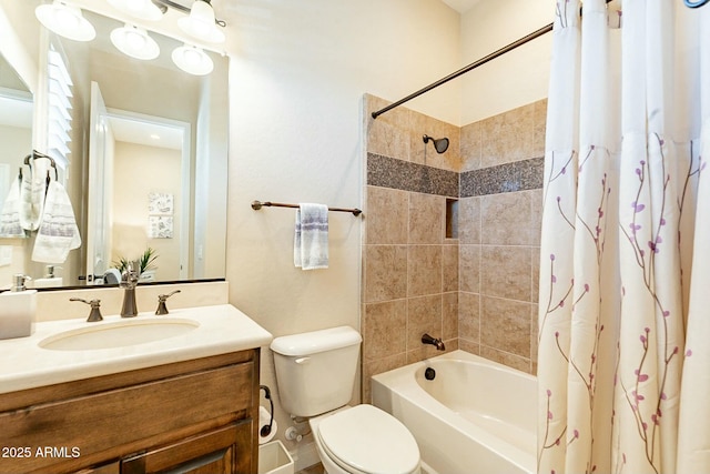 bathroom featuring shower / tub combo, vanity, and toilet