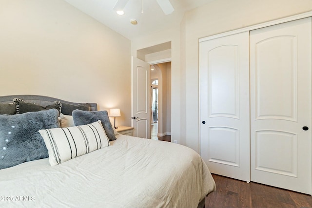 bedroom with a ceiling fan, a closet, and wood finished floors