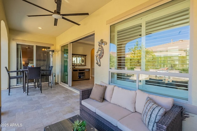 view of patio featuring ceiling fan and an outdoor living space