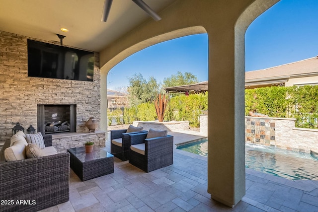 view of patio / terrace featuring an outdoor living space with a fireplace