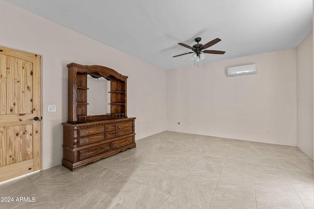 tiled empty room featuring an AC wall unit and ceiling fan