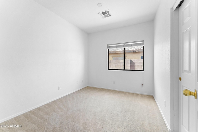 empty room with light colored carpet