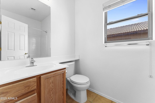 bathroom featuring walk in shower, tile patterned floors, toilet, and vanity