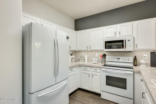 kitchen featuring white cabinetry, white appliances, dark wood-style floors, and decorative backsplash