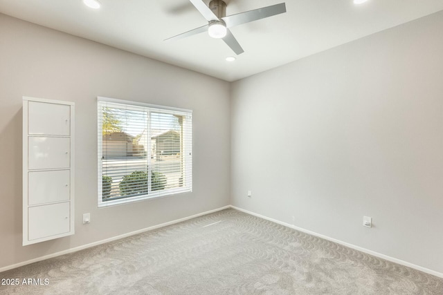 empty room with recessed lighting, carpet flooring, ceiling fan, and baseboards