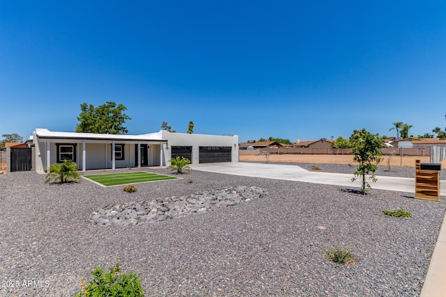 13012 N 36th Dr, Phoenix, AZ 85029 - rear view of property featuring concrete driveway, stucco siding, and a porch