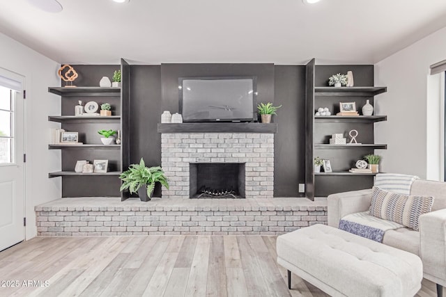 13012 N 36th Dr, Phoenix, AZ 85029 - living room featuring wood finished floors, a brick fireplace, and recessed lighting
